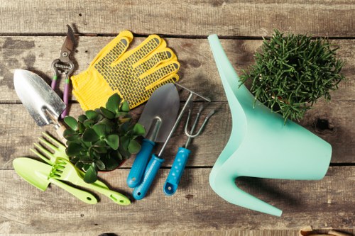 Team maintaining a lush garden with modern gardening tools in Berowra.